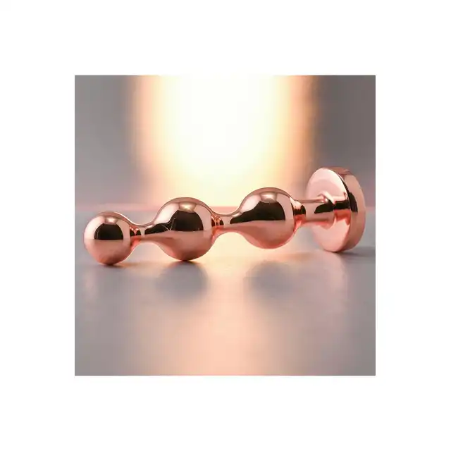 Gender X - Gold Digger S. Mały, elegancki i stylowy. Metalowa wtyczka analna w kolorze rose gold z czarnym klejnotem w podstawie. 