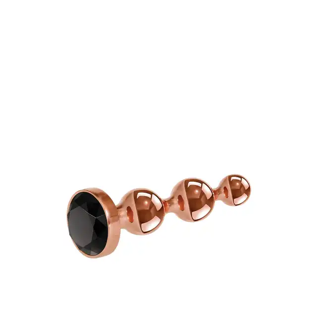 Gender X - Gold Digger M. Średni, elegancki i stylowy. Metalowa wtyczka analna w kolorze rose gold z czarnym klejnotem w podstawie. 