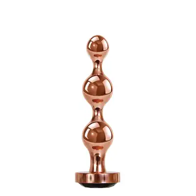 Gender X - Gold Digger M. Średni, elegancki i stylowy. Metalowa wtyczka analna w kolorze rose gold z czarnym klejnotem w podstawie. 