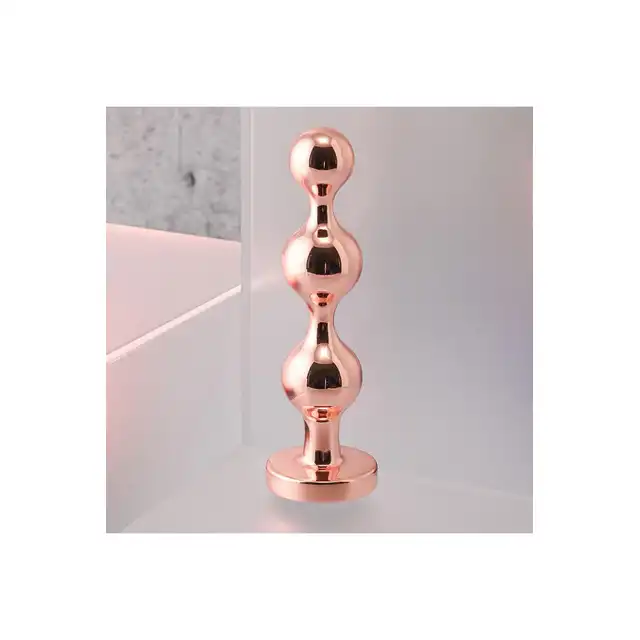 Gender X - Gold Digger S. Mały, elegancki i stylowy. Metalowa wtyczka analna w kolorze rose gold z czarnym klejnotem w podstawie. 