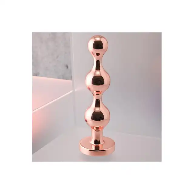 Gender X - Gold Digger L. Duży, elegancki i stylowy. Metalowa wtyczka analna w kolorze rose gold z czarnym klejnotem w podstawie. 