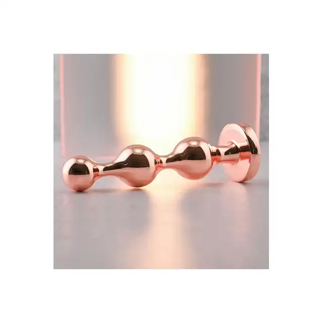 Gender X - Gold Digger L. Duży, elegancki i stylowy. Metalowa wtyczka analna w kolorze rose gold z czarnym klejnotem w podstawie. 