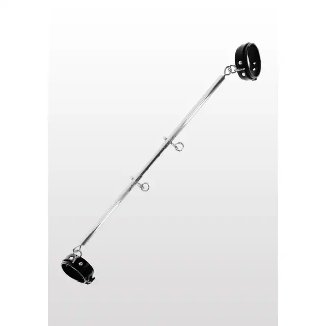 Taboom - Expandable Spread Bar with Ankle Cuffs. Wytrzymały drążek w zestawie z kajdankami na kostki. Regulacja długości drążka pozwala Ci rozchylić nogi partnerki tak jak lubisz