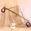 Taboom - Expandable Spread Bar with Ankle Cuffs. Wytrzymały drążek w zestawie z kajdankami na kostki. Regulacja długości drążka pozwala Ci rozchylić nogi partnerki tak jak lubisz