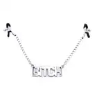 Oproducts - Nipple Clamps Bitch. Stalowe  regulowane klamerki na sutki z masywnym napisem Bitch i łańcuszkiem