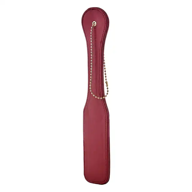  Blaze - Elite Paddle Red. Elitarnie wyglądająca packa z czerwonej sztucznej skóry idealna do zabaw BDSM. Piękne złote elementy. 
