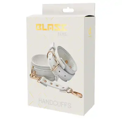 Blaze - Elite Handcuffs White. Stylowe regulowane kajdanki wykonane z białej sztucznej skóry wzbogacone o złote detale. 