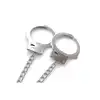 Nixie - Metal Butt Plug &amp; Handcuffs Silver. Zniewalające połączenie korka analnego i łańcuszka prowadzącego do zmysłowych metalowych kajdanek