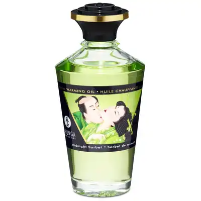 Shunga - Warming Oil Sparkling Midnight Sorbet. Rozgrzewający jadalny olejek do masażu o miętowym aromacie, właściwości pielęgnujące i pobudzające zmysły