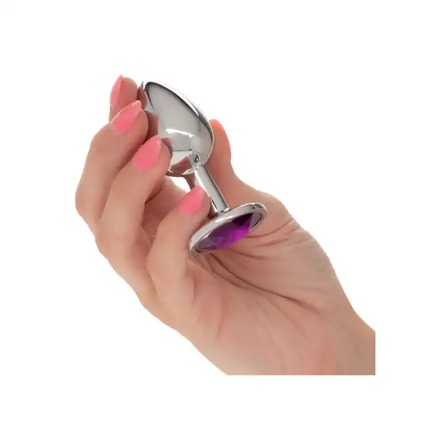 CalExotics - Jewel Small Amethyst Plug. Korek analny o bezszwowej metalowej konstrukcji z fioletowym kryształkiem w podstawie