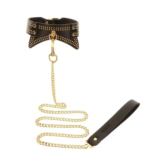 Taboom - Studded Collar and Leash. Czarną obroża ze smyczą, zdobiona złotymi ćwiekami, zapewnia nie tylko stylową, ale także komfortową i intymną powściągliwość