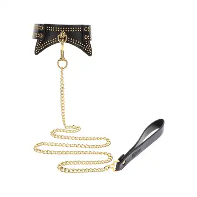 Taboom - Studded Collar and Leash. Czarną obroża ze smyczą, zdobiona złotymi ćwiekami, zapewnia nie tylko stylową, ale także komfortową i intymną powściągliwość