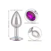 CalExotics - Jewel Small Amethyst Plug. Korek analny o bezszwowej metalowej konstrukcji z fioletowym kryształkiem w podstawie