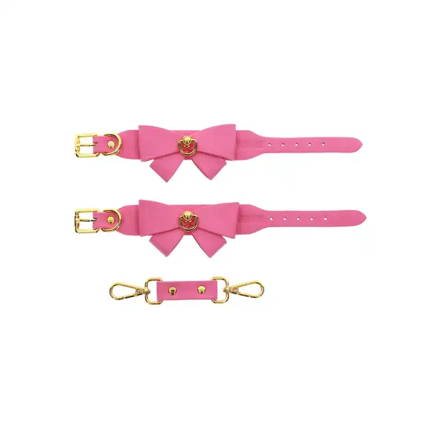 Taboom - Malibu Wrist Cuffs Pink. Różowe mankiety z uroczą kokardką i pozłacanymi detalami, łączące w sobie styl i przyjemność, zapewniające regulowane dopasowanie