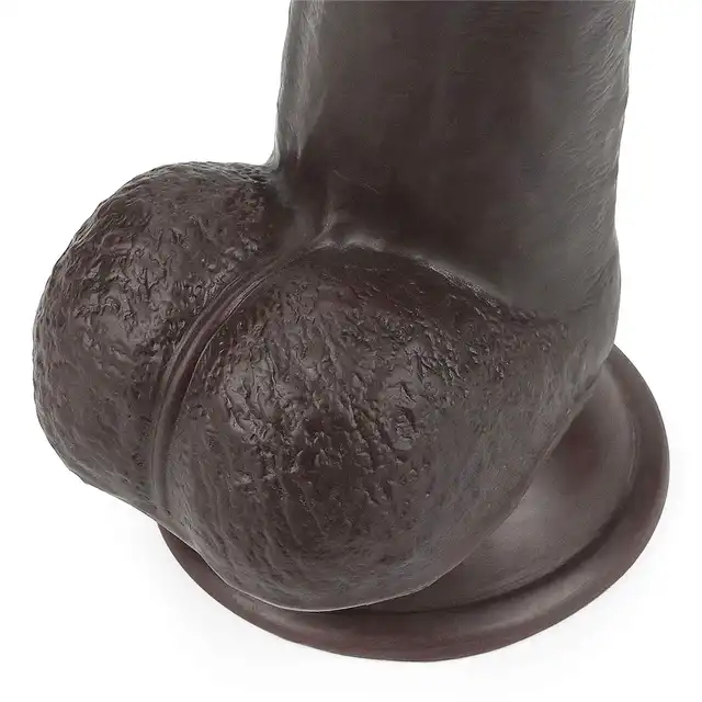 LoveToy - Sliding Skin Dual Layer Dong 9inch Brown. Realistyczne dildo z dwuwarstwowego TPE, wyposażone w technologię przesuwanej skóry i mocną przyssawkę