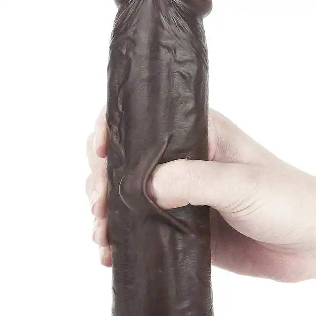 LoveToy - Sliding Skin Dual Layer Dong 9inch Brown. Realistyczne dildo z dwuwarstwowego TPE, wyposażone w technologię przesuwanej skóry i mocną przyssawkę