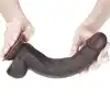 LoveToy - Sliding Skin Dual Layer Dong 9inch Brown. Realistyczne dildo z dwuwarstwowego TPE, wyposażone w technologię przesuwanej skóry i mocną przyssawkę