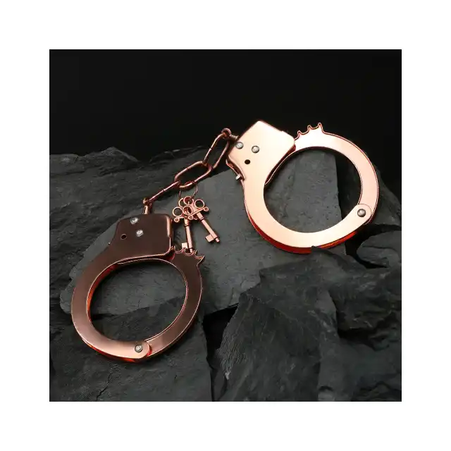 Toyjoy - Rose Gold Metal Handcuffs. Klasyczne metalowe kajdanki w kolorze różowego złota, w zestawie 2 kluczyki