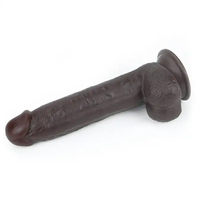 LoveToy - Sliding Skin Dual Layer Dong 9inch Brown. Realistyczne dildo z dwuwarstwowego TPE, wyposażone w technologię przesuwanej skóry i mocną przyssawkę