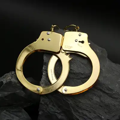 ToyJoy - Gold Handcuffs. Klasyczne metalowe kajdanki w złotym kolorze, w zestawie 2 kluczyki