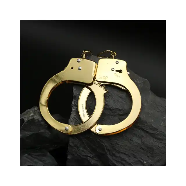 ToyJoy - Gold Handcuffs. Klasyczne metalowe kajdanki w złotym kolorze, w zestawie 2 kluczyki