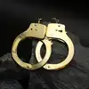ToyJoy - Gold Handcuffs. Klasyczne metalowe kajdanki w złotym kolorze, w zestawie 2 kluczyki