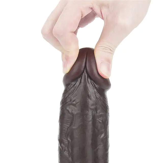 LoveToy - Sliding Skin Dual Layer Dong 9inch Brown. Realistyczne dildo z dwuwarstwowego TPE, wyposażone w technologię przesuwanej skóry i mocną przyssawkę