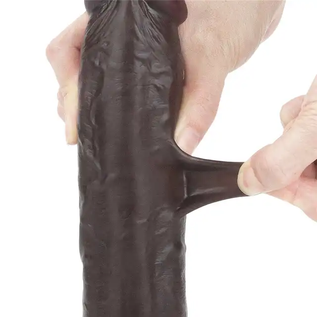 LoveToy - Sliding Skin Dual Layer Dong 9inch Brown. Realistyczne dildo z dwuwarstwowego TPE, wyposażone w technologię przesuwanej skóry i mocną przyssawkę