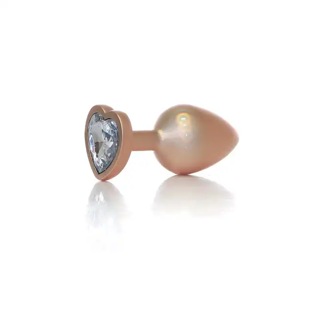 B-Series - Pearl Gold Heart Plug Clear S. Plug analny w rozmiarze S, wykonany z gładkiej stali nierdzewnej, połączenie elegancji, bezpieczeństwa i zmysłowej stymulacji.