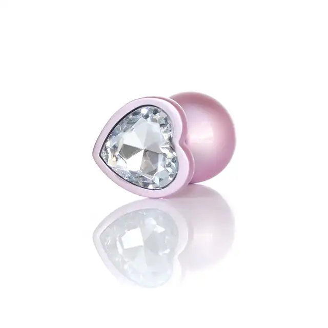 B-Series - Pearl Pink Heart Plug Clear M. Korek anany wykonany z wysokiej jakości stali nierdzewnej, ozdobiony pięknym kryształkiem w kształcie serca w rozmiarze M