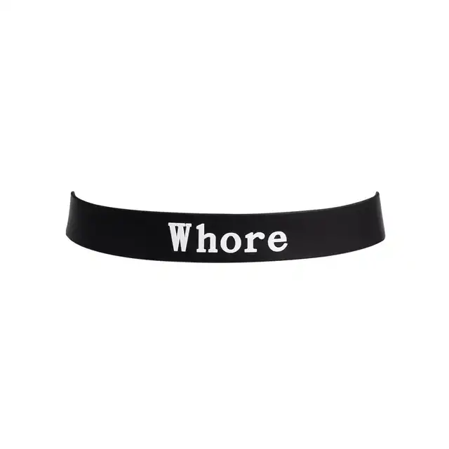 Rimba - Collar Whore. Stylowa i odważna obroża z napisem „Whore”, wykonana z wysokiej jakości silikonu, zapewniająca komfort i efektowny wygląd