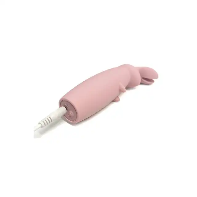 Nude - Hazel Rabbit Massager. Niewielki wibrator z króliczymi uszkami do stymulacji łechtaczki z 10 wibracjami i 3 prędkościami